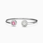 Close-up of luxury bracelet with vivid pink spinel and radiant white diamonds set in sleek white gold - NIRA Bracele lucentset